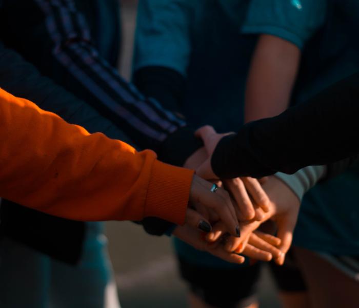 Group of people huddling up
