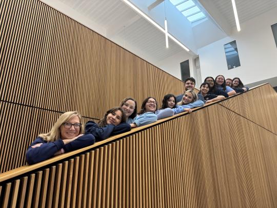 The School Counseling class of 2026 is all smiles as they pose along the stairwell!